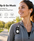 Woman jogging wearing a Clip On Mini MP3 Player With USB Clip, Ultra Compact Music Player For On The Go with earphones.