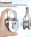 Heavy Duty Cable Snatch Pulley Block With 32 Ft Rope And Hook Dual Bearings Inside For Smooth Operation Chrome Plated Steel Construction 800Lb Lifting Capacity Rugged For Garage Attic Kayak Deer Hanging Gym Equipment 1 Pack compact chrome-plated steel pulley block held in hand