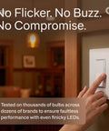 Buttery Smooth LED Dimmer Switch With Sleek Paddle Design For Single Pole And Three Way Installations To Banish Flicker And Buzz While Serving Up Straight Up Reliable Light Control For Everyday Bulbs Around The House, hand adjusting the switch in a cozy room.