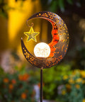 Lit Moonlit Solar Lantern For Outdoor Decor Ideal For Patio Path Garden Or Lawn Crackle Glass Globe Stake Light Waterproof Bronze Finish Warm LED Glow Easy Sun Powered Setup Upgraded Battery And Large Solar Panel in moon and star design.