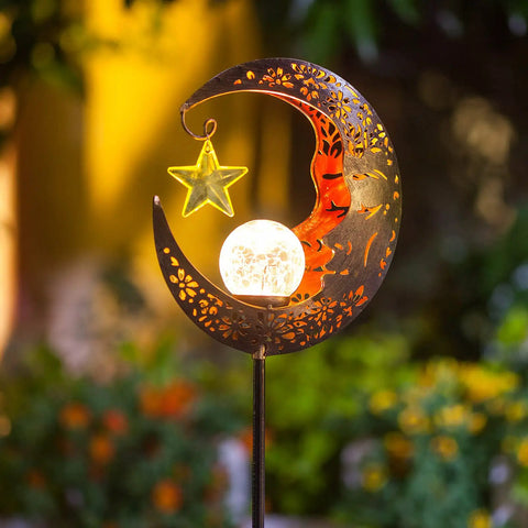 Lit Moonlit Solar Lantern For Outdoor Decor Ideal For Patio Path Garden Or Lawn Crackle Glass Globe Stake Light Waterproof Bronze Finish Warm LED Glow Easy Sun Powered Setup Upgraded Battery And Large Solar Panel in moon and star design.