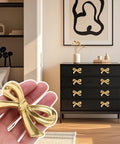 Vintage Bow Shaped Dresser Knobs For Desk Wardrobe TV Cabinet And Bookcase In Antique Gold Hardware Pulls 4 Pack Durable Solid Zinc Alloy Drawer Handles displayed on black dresser.