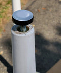 Close-up of Quarter Inch Threaded Leveling Feet With PTFE Bottom For Carpets And Hardwood Floors attached to furniture leg.