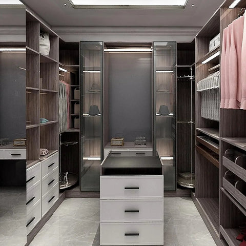 Modern closet with dark wood shelves and white drawers, showcasing storage options without installed handles. Ideal for hidden grip handles.