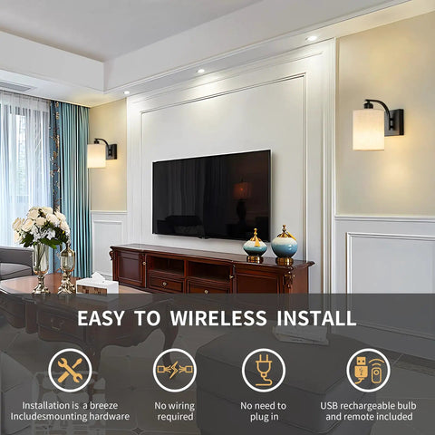 Sleek Matte Black Rechargeable Wall Sconces Set Of Two Wireless Dimmable Led Lights With Remote Easy Setup For Bedroom And Living Room All Day Battery Operated Lamps Heavy Duty Build Badass Style mounted beside a television.