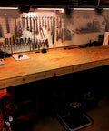 Workbench with tools and 18 Inch Plug In Under Cabinet Lighting With 1000 Lumen LED 5 Foot Cord Dual USB Ports 120V 3 Prong Outlet