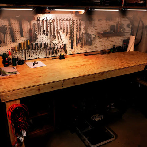 Workbench with tools and 18 Inch Plug In Under Cabinet Lighting With 1000 Lumen LED 5 Foot Cord Dual USB Ports 120V 3 Prong Outlet