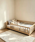 Twin Montessori Floor Bed With Full Surround Safety Guardrails For Little Explorers, Crafted From Premium Pine Wood, with plush toys.