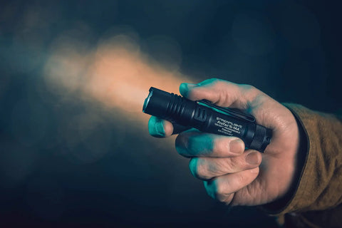 Hand holding Dual Fuel ProTac 350 Lumen Tactical Light for Everyday Carry Powers From CR123A Or AA Battery High Low Strobe Modes