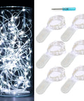 Battery Operated Fairy Lights Six Pack No Remote Waterproof Firefly String Lights On Silvery Copper Wire With Twenty LEDs Each Seven Feet Long For Wedding Patio Bedroom Christmas Decor Cool White, displayed in a jar and laid out with a screwdriver.