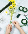 Hands using All In One DIY Floral Arrangement Kit With Green Wire And Floral Tape Including 26 Gauge Stem Wire 114 Feet 22 Gauge