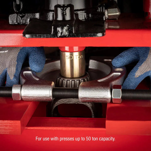 Close-up of Beefy Heavy-Duty 6-Piece Press Punch Kit for 50-Ton Machines in use with metal components and gloves.