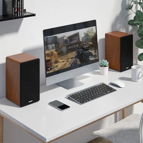 Bluetooth Bookshelf Speakers 40W X 2 With 4 Inch Woofer on desk setup with PC, showcasing easy setup for quick home stereo upgrade.