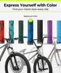 Colorful lock-on grips displayed on bike handlebars, featuring non-slip half-waffle design and deep sea blue option.