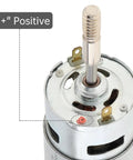 Close-up of Badass 775 DC Motor 12 Volt 3000 RPM showing positive terminal and output shaft for cooling projects.