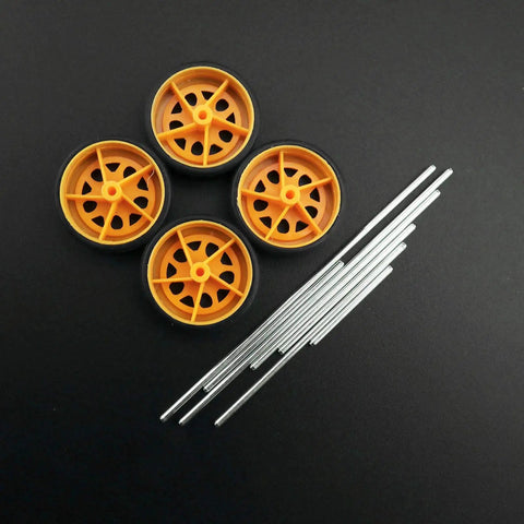 78 Piece Plastic Gear Kit For Motors And Robots with yellow wheels and metal axles on black background