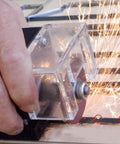 Hand using Heavy Duty Pneumatic Nick Grinder That Nails Pinpoint Accuracy For Die Cutting And Rule Protection features with sparks.