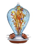Blown Glass Hummingbird Feeder For Outdoors Hanging 34oz Comet Design, vibrant blue glass with orange accents, front view.