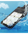 Top Tier Outdoor Solar Flood Light For Yard And Patio Security IP67 Waterproof showing water splashing around it.