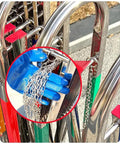 Heavy Duty Adjustable Stainless Steel Retractable Safety Gate Featuring Hella Smooth Moving Universal Casters And Rock Solid Brakes For Tight Garage And Store Layouts with blue glove holding chains.