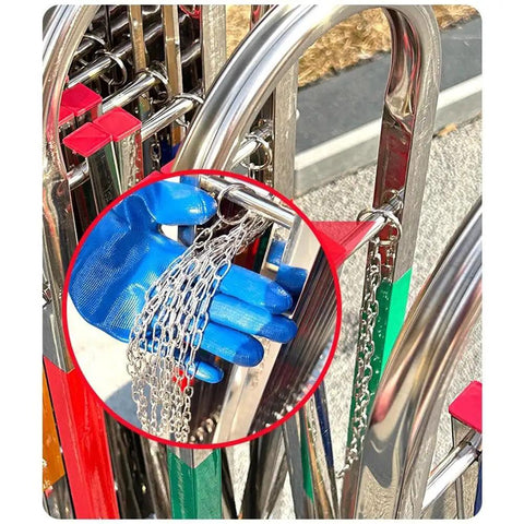 Heavy Duty Adjustable Stainless Steel Retractable Safety Gate Featuring Hella Smooth Moving Universal Casters And Rock Solid Brakes For Tight Garage And Store Layouts with blue glove holding chains.