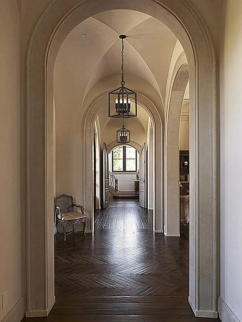 Vintage Foyer Lantern Pendant Light With 4 Light Iron Matte Black Chandelier Hard Wired Fixture hanging in elegant arched hallway