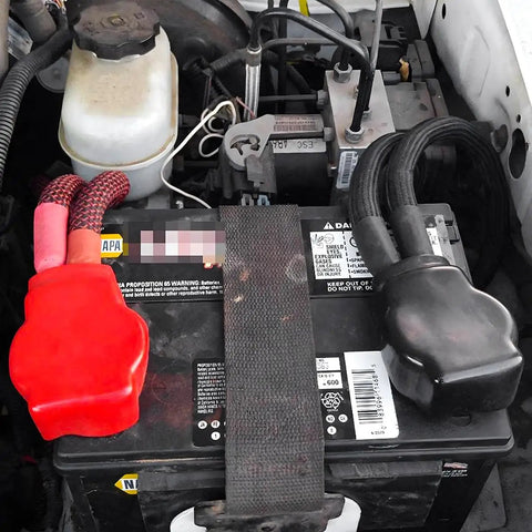 Heavy Duty Car Battery Terminal Kit With Four Piece 3 8 Inch Pure Copper Wire Lugs And Heat Shrink Tubing Positive Negative Cable Ends attached to battery.