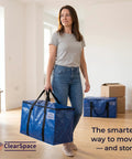 Woman holding Beefy Heavy Duty Moving Bags Set With Backpack Straps And Sturdy Zippers And Handles Extra Large 86 Liters 23 Gallons