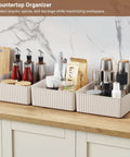 Kickass Plastic Storage Bins With Lids Full Set three ivory stackable organizers on kitchen countertop for spices and snacks.