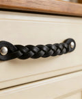 Braided Leather Drawer Pulls Set In Black Six And A Half Inch Length By One Inch Width on cream cabinet for industrial charm