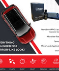 Top view of a red car with 80 Percent SiO2 Nano Ceramic Coating kit, towels, and applicators for paint protection on display.