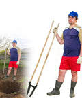 Person using a Heavy Duty Manual Post Hole Digger featuring sturdy wood handle and razor sharp blades for tough clay soil.