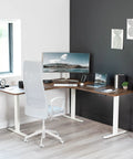 Vivo Electric L Shaped Corner Standing Desk With Memory Height Adjustment And White Finish For Office Ergonomic Sit Stand Workstation Dual Motor Lift System Smooth Operation Spacious Workspace, angled view with monitor and chair.