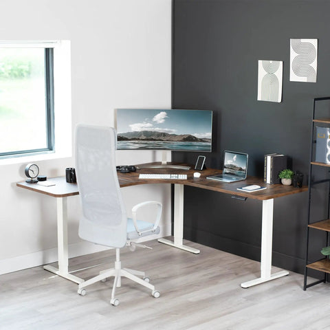 Vivo Electric L Shaped Corner Standing Desk With Memory Height Adjustment And White Finish For Office Ergonomic Sit Stand Workstation Dual Motor Lift System Smooth Operation Spacious Workspace, angled view with monitor and chair.