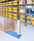 Heavy Duty Manual Pallet Wrapper With Cushioned Grip And Smooth 360 Degree Turntable Stretch Film Dispenser in use with wrapped box in warehouse.