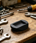 Round Rubber Chair Foot Pads 4 Pack on workbench surrounded by tools, Non Slip Furniture Feet for Chair Legs and Wheels focus