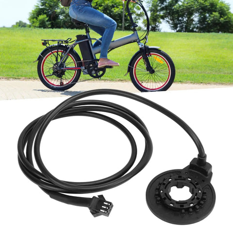 High Sensitivity Left Side Pedal Assist Sensor PAS for Electric Bikes With SM Connector 36V 48V Compatibility near a parked e-bike.