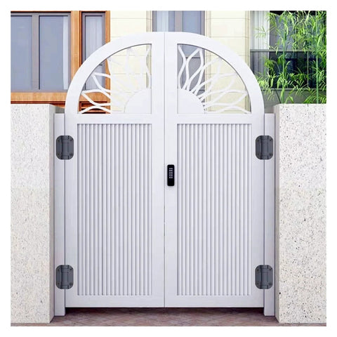 Two white metal gate hinges mounted on a decorative arch gate, front view