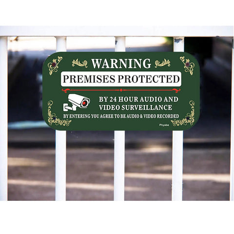 Real Sturdy Aluminum Video Surveillance Signs 2 Pack Keep Your Property Locked Down Smooth Motion Warning Decals For Homes And Buildings Zero Hassle Wall Mounting Setup Installed on a fence.