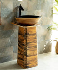Slick Ceramic Vessel Sink With Retro Industrial Pedestal Basin Design, wooden pedestal, black bowl, stylish bathroom feature.