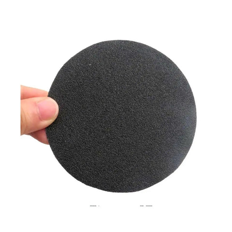Grab These 30 Pc Four Inch Silicon Carbide Sanding Discs With Hook And Loop Backing For Super Fast Polishing Jobs Across All Grit Levels From Coarse To Mirror Finish Ready, 4 inch sanding disc in hand.