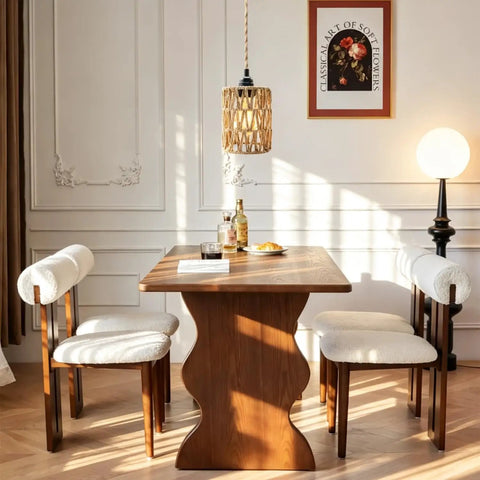 Amp Up Your Space With This Straight Up Badass Boho Pendant Light Featuring A Heavy Duty 16.5 Ft Plug In Swag Cord And Handwoven Rattan Cylinder Shade For Zero Hassle Setup And Chill Room Vibes above a wooden table with cozy chairs.