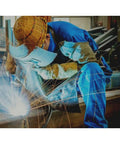 Essential Welding Cooling Vest For Industrial Workers In Extreme Heat, worn by welder in protective gear creating sparks.
