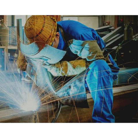 Essential Welding Cooling Vest For Industrial Workers In Extreme Heat, worn by welder in protective gear creating sparks.