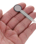 Close-up of MECCANIXITY FSR402B thin-film pressure sensor, circular sensing pad on flexible gray film with two metal leads.