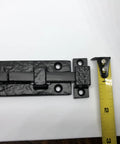 Rock Solid Heavy Duty Cast Iron Sliding Door Bolt Latch 5 Inch Mounting Plate with tape measure for scale