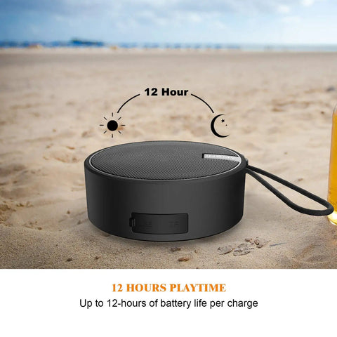 Rugged IP67 Waterproof Bluetooth Speaker With Submersible Design on the beach, showing compact size and battery life indicator.