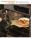 Removing pizza with oak peel from oven on 5 Piece Round Pizza Stone Set With 13 Inch Stone, Oak Wood Pizza Peel, 12 By 17 Paddle.