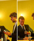 Two men in suits using a No Brainer Push Button Beer Foam Maker at a bar to create frosty beer foam.