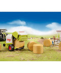 Claas Rollant 250 Round Baler Toy For Kids Realistic Farm Equipment Playset with bales in a farm setting